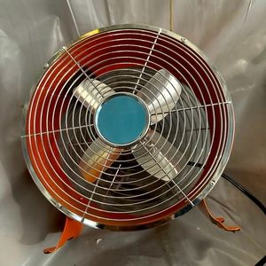 Small orange metal fan